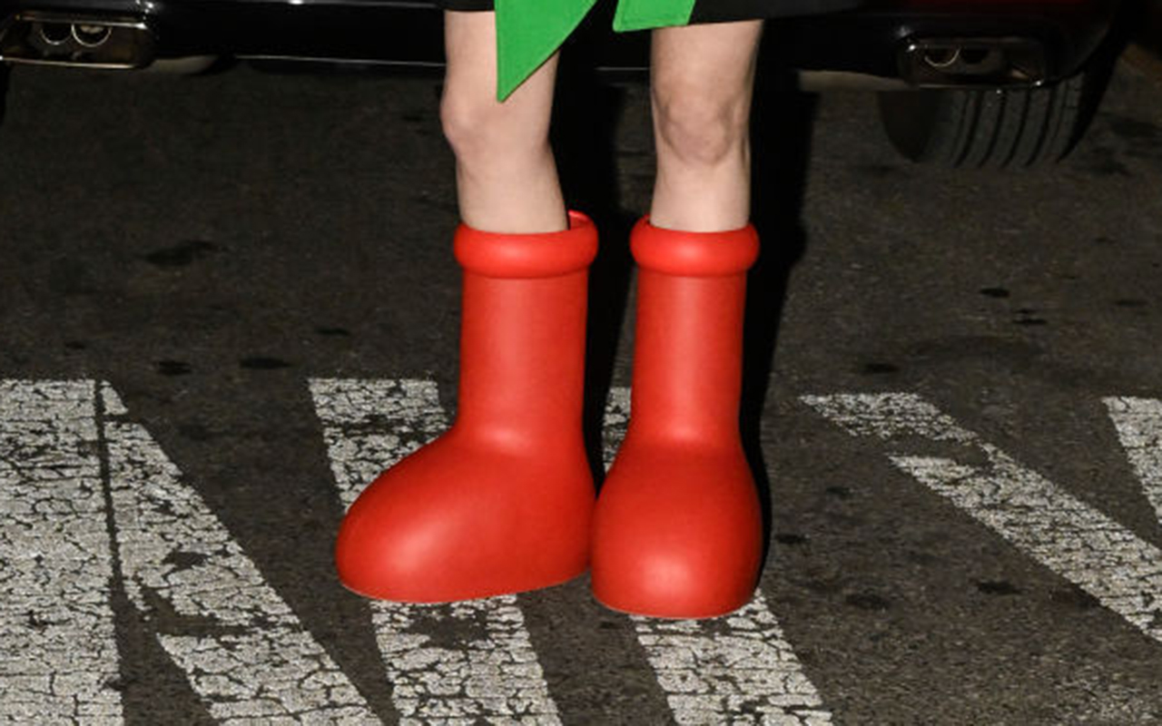 NEW YORK, NEW YORK - FEBRUARY 10: A guest is seen wearing a black and green jacket, white top, red beret and red boots outside the Collina Strada show during New York Fashion Week F/W 2023 on February 10, 2023 in New York City. (Photo by Daniel Zuchnik/Getty Images)
