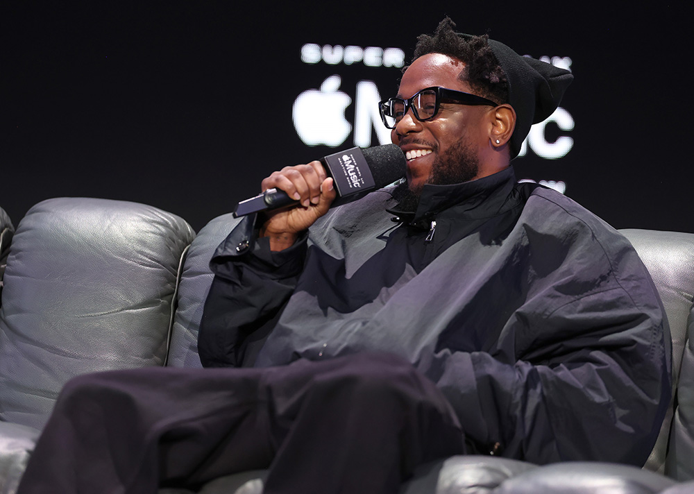 Kendrick Lamar at the Super Bowl LIX Apple Music Halftime Show press conference on Feb. 6 in New Orleans, athleisure, windbreaker, Asics
