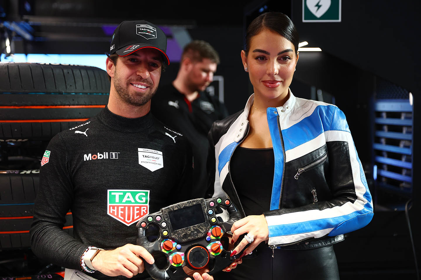 JEDDAH, SAUDI ARABIA - FEBRUARY 14: Antonio Felix da Costa of Portugal and TAG Heuer Porsche Formula E Team poses for a photograph with Georgina Rodriguez in the garage during the Jeddah E-Prix, Round 3 of the 2025 FIA Formula E World Championship at Jeddah Corniche Circuit on February 14, 2025 in Jeddah, Saudi Arabia. (Photo by Joe Portlock/LAT Images)