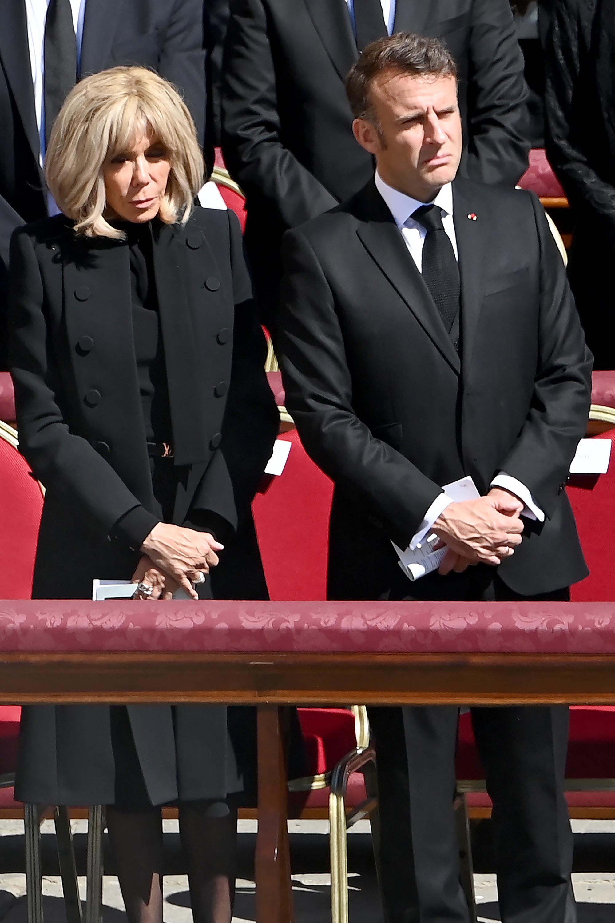 France's President Emmanuel Macron (R) and his wife Brigitte Macron attend late Pope Francis' funeral ceremony at St Peter's Square in The Vatican on April 26, 2025. (Photo by Isabella BONOTTO / AFP) (Photo by ISABELLA BONOTTO/AFP via Getty Images)