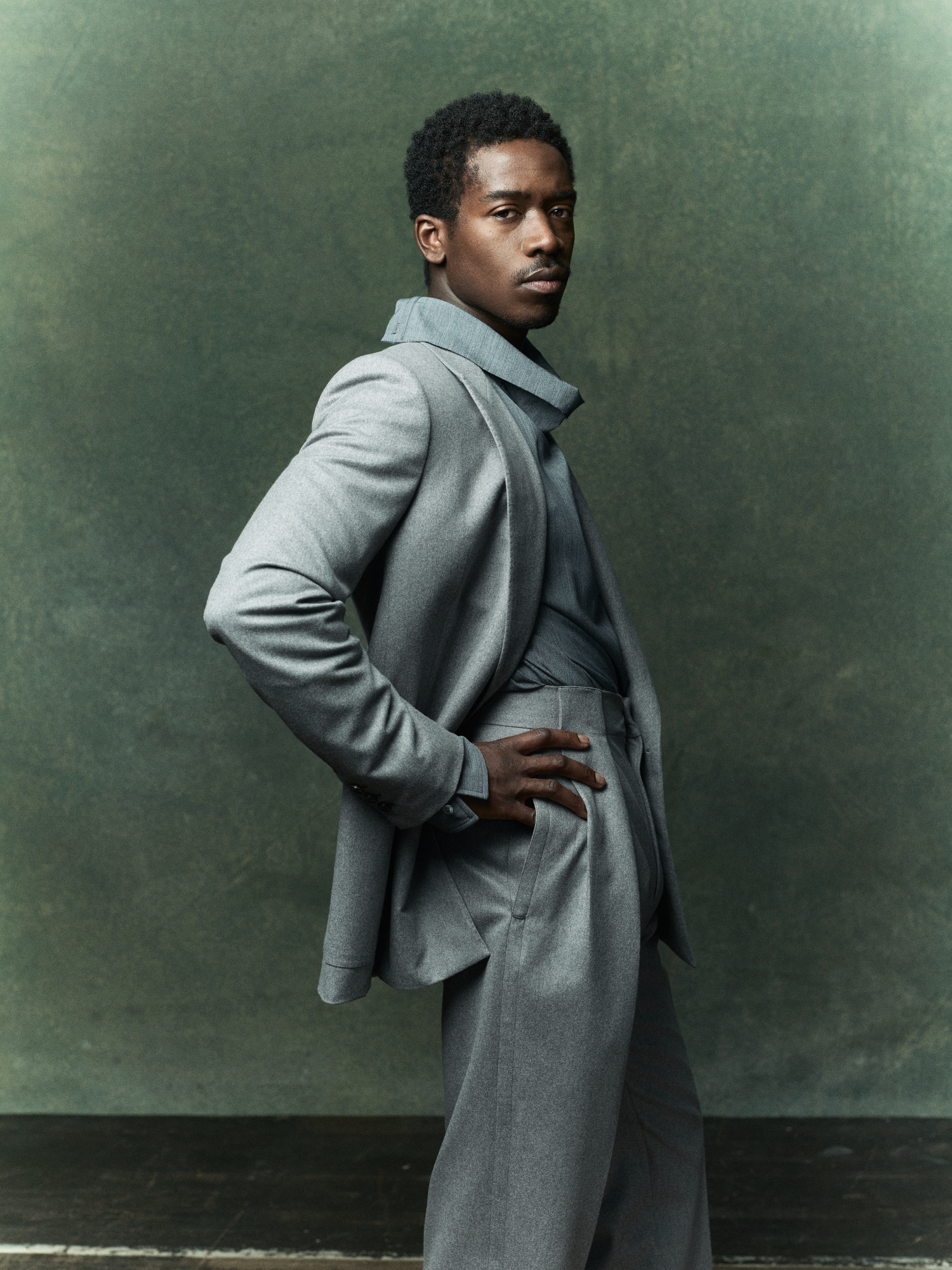 Zegna fine wool suit; Lanvin cotton woven high-neck top.