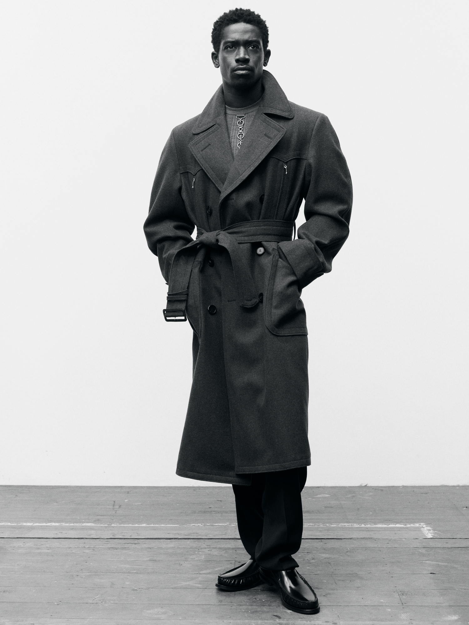 Prada Shetland chevron coat; wool knitwear; stuoia trousers; spazzolato leather loafers.