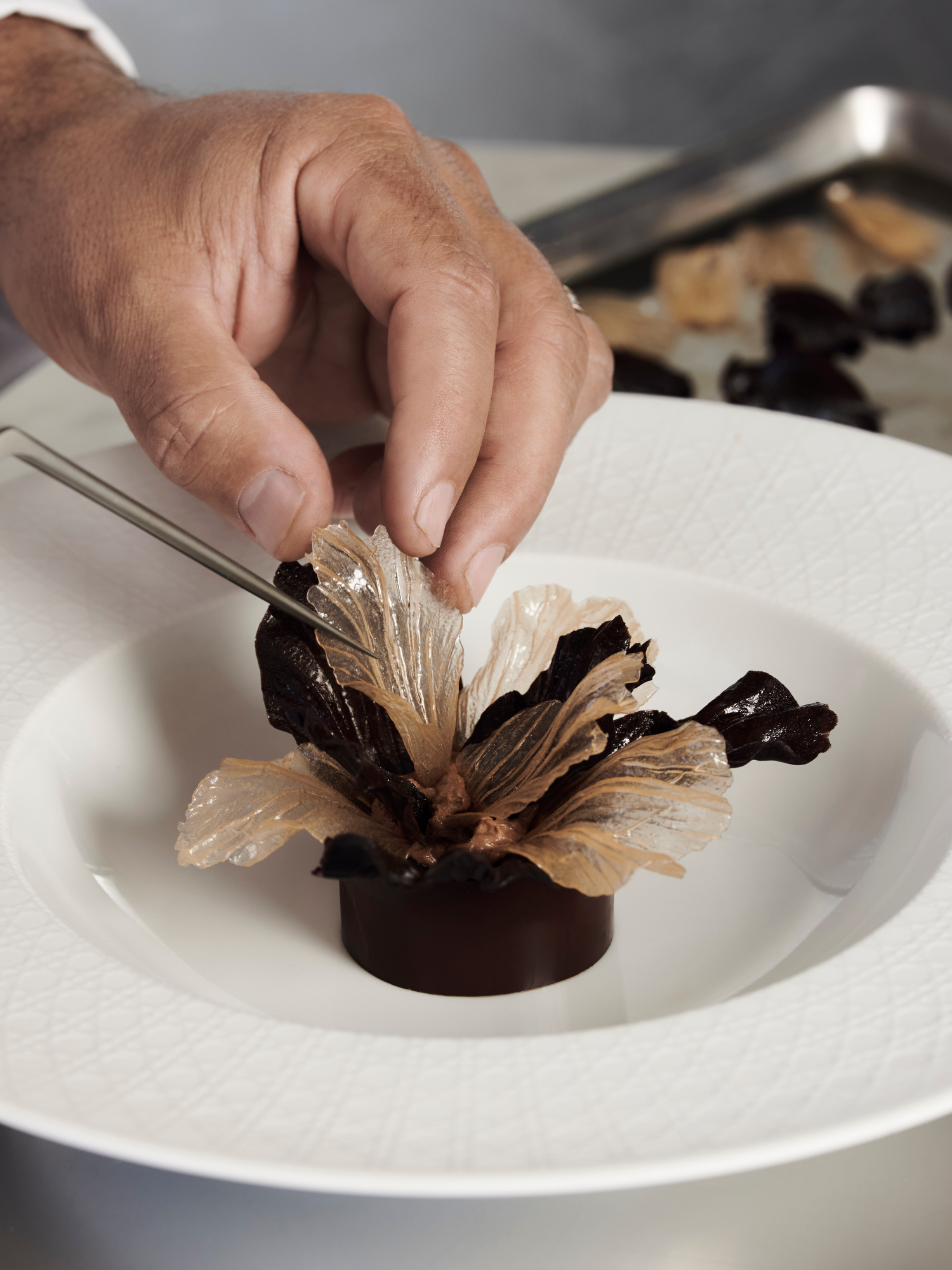 Chef Mauro Colagreco prepares his Iris dessert at the Monsieur Dior restaurant in Saint-Tropez