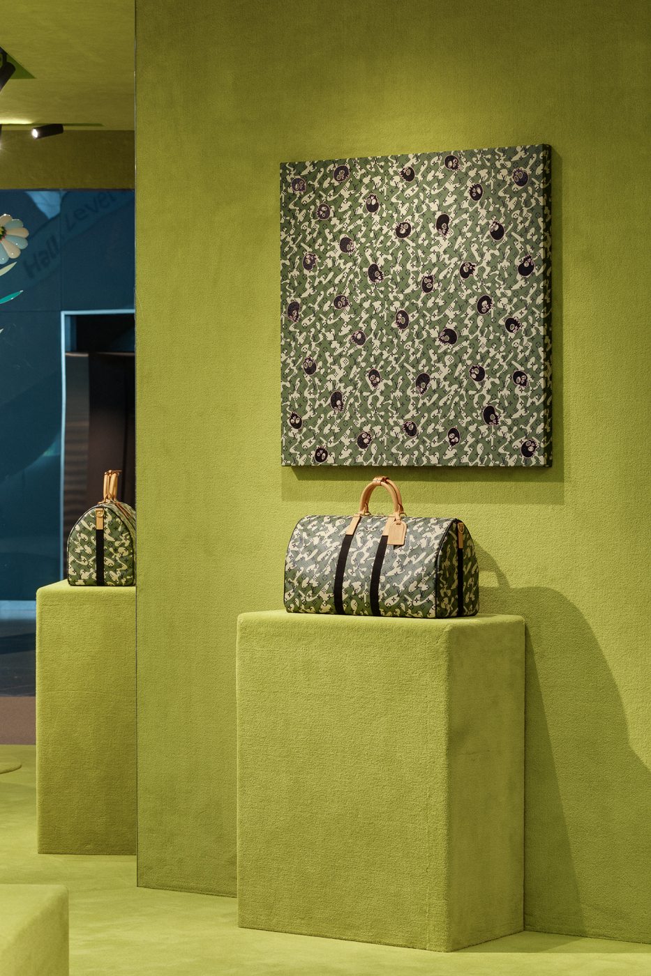 Takashi Murakami's Monogramouflage pattern featured on a canvas work and a Louis Vuitton Keepall handbag at Art Basel Hong Kong