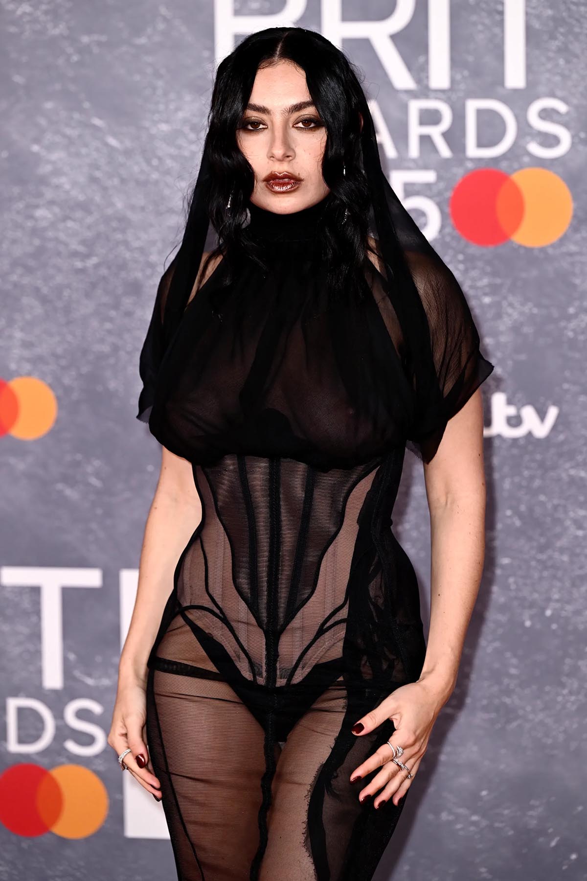Charli XCX wears sheer Dilara Fındıkoğlu’s fall 2025 collection dress attends The BRIT Awards 2025 at the InterContinental London - The O2 on March 01, 2025 in London, England.