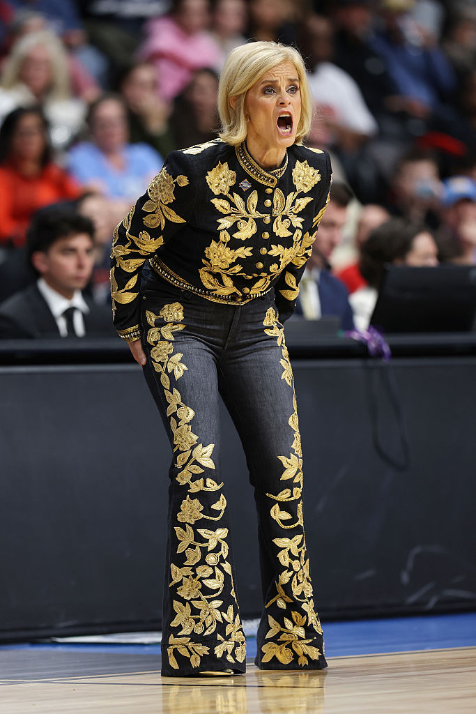 kim mulkey sweet 16 outfit, alice and olivia black and gold baroque denim, Head coach Kim Mulkey of the LSU Lady Tigers calls out instructions in the third quarter against the NC State Wolfpack in the Sweet Sixteen round of the NCAA Women's Basketball Tournament at Spokane Arena on March 28, 2025 in Spokane, Wash