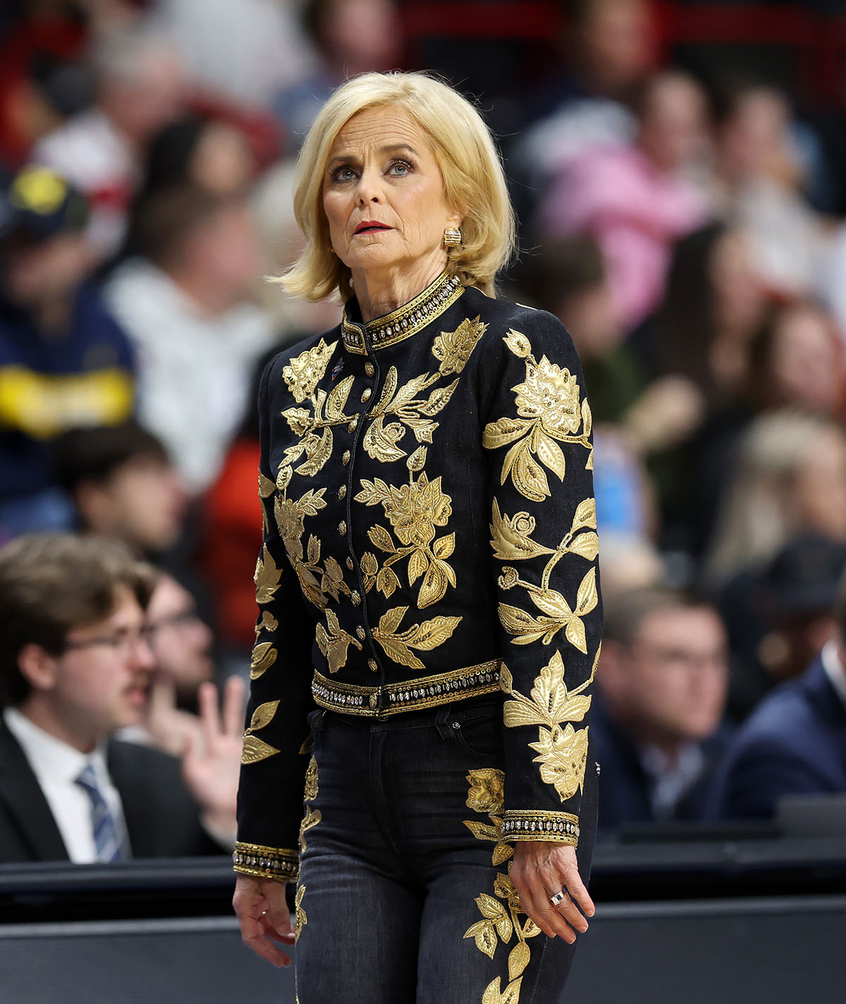 kim mulkey sweet 16 outfit, alice and olivia black and gold baroque denim, Head coach Kim Mulkey of the LSU Lady Tigers calls out instructions in the third quarter against the NC State Wolfpack in the Sweet Sixteen round of the NCAA Women's Basketball Tournament at Spokane Arena on March 28, 2025 in Spokane, Wash