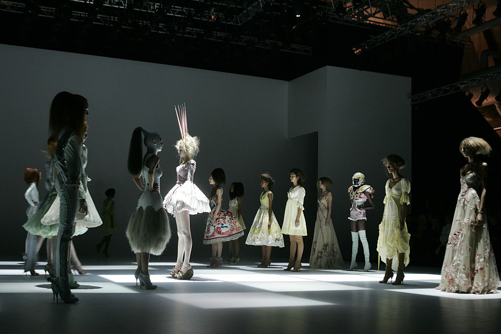 Models on the catwalk at the Alexander McQueen Spring-Summer 2005 ready-to-wear fashion collection, during the Paris Fashion Week. (Photo by Stephane Cardinale/Corbis via Getty Images)