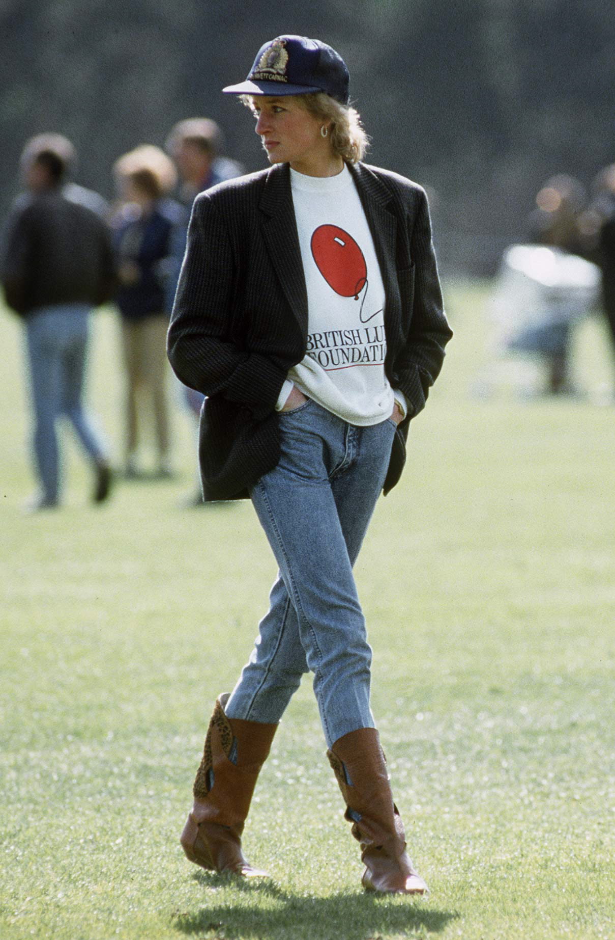 WINDSOR, UNITED KINGDOM - MAY 02: Diana, Princess Of Wales At Guards Polo Club. The Princess Is Casually Dressed In A Sweatshirt With The British Lung Foundation Logo On The Front, Jeans, Boots And A Baseball Cap. (Photo by Tim Graham Photo Library via Getty Images)