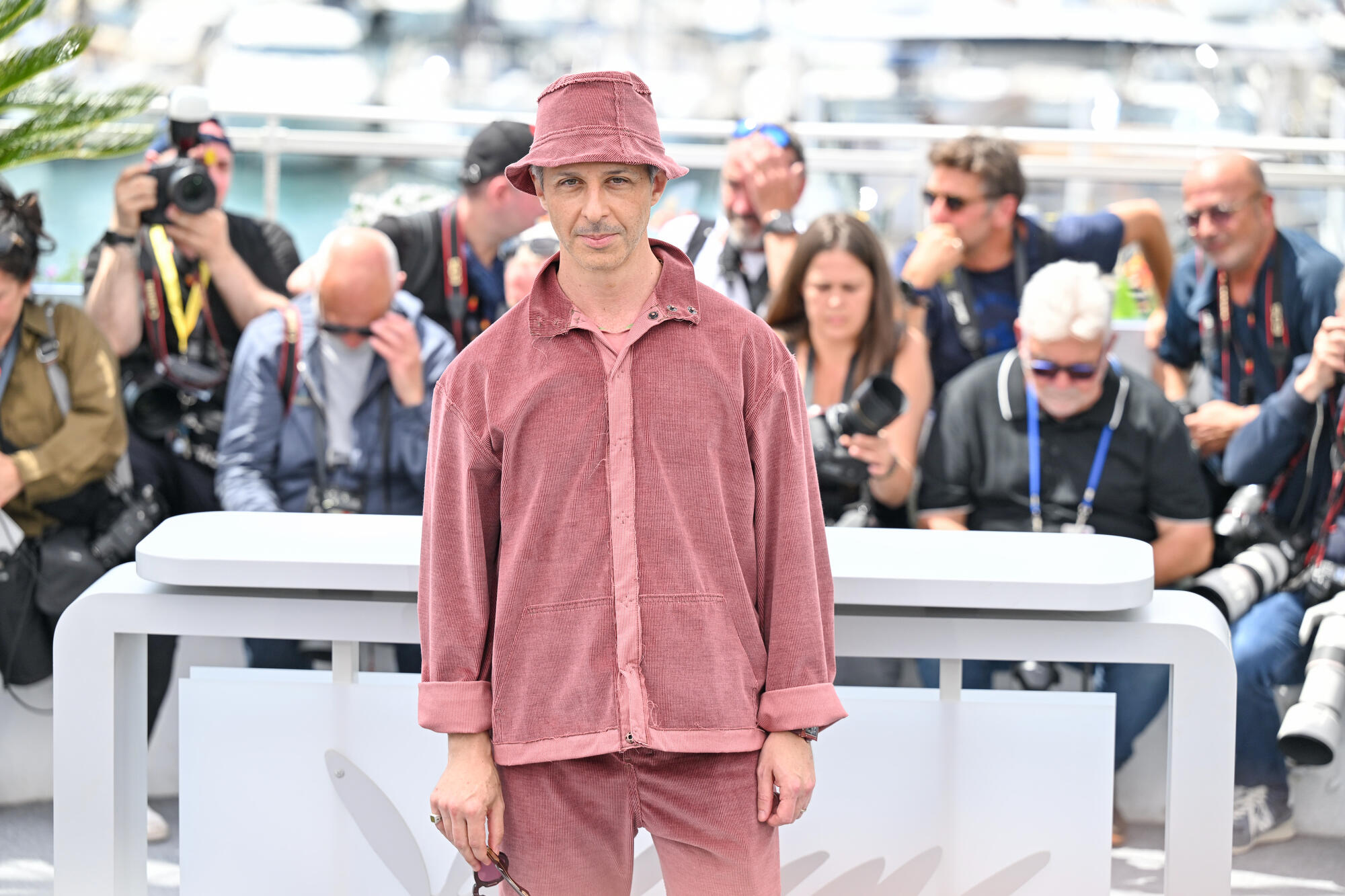 Jeremy Strong pink bucket hat at the Jury Photocall - 78th Cannes Film Festival held at Palais des Festivals on May 13, 2025 in Cannes, France.
