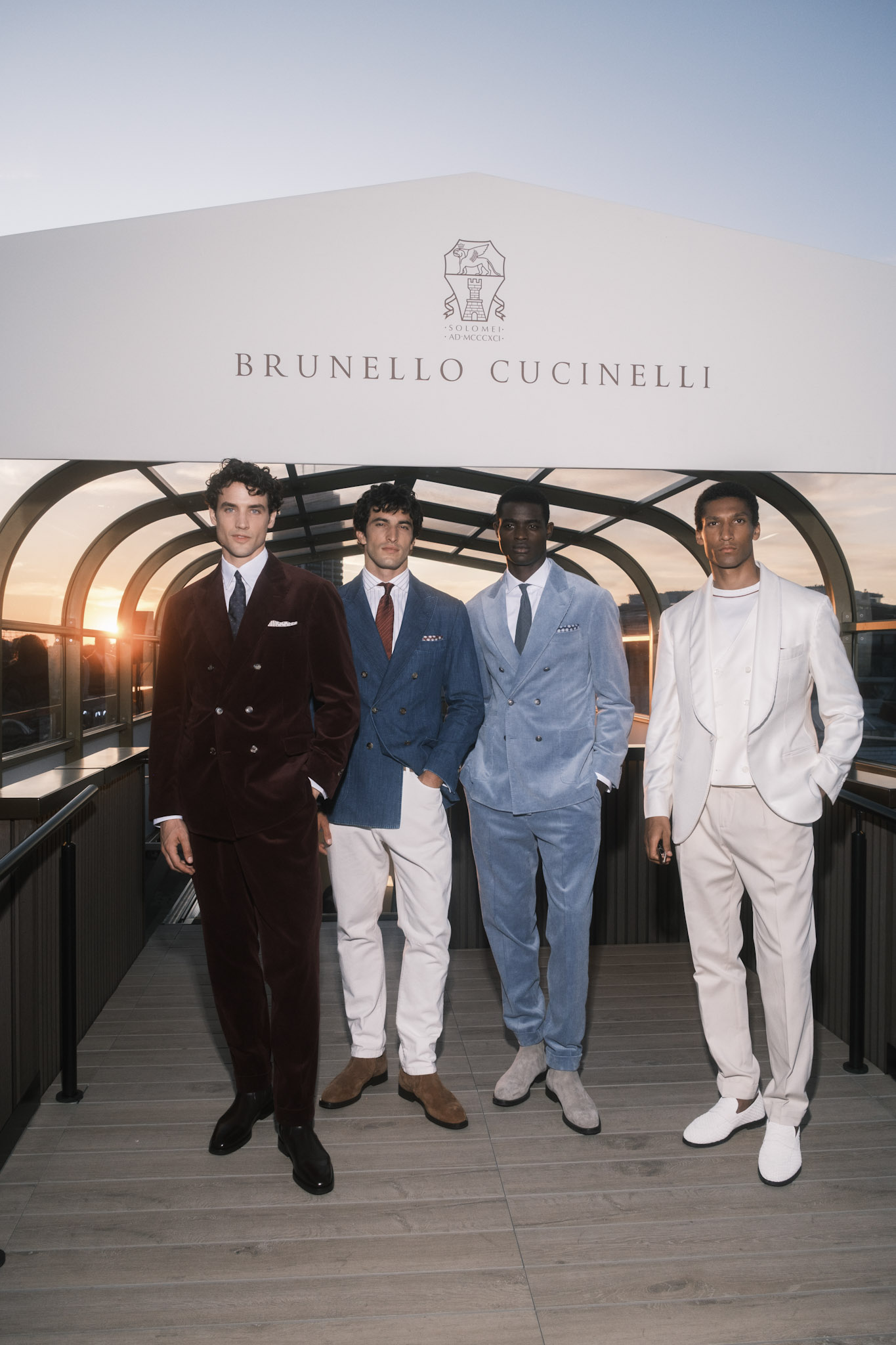 Models sporting looks from