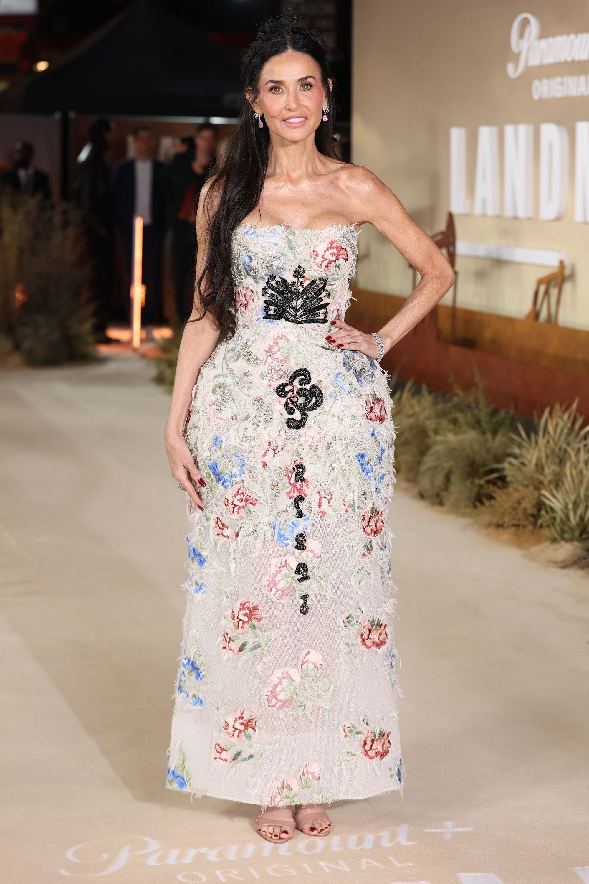 Demi Moore wears a dress from Erdem's spring 2026 collection as she attends the "Landman" Season Two UK Premiere at Cineworld Leicester Square on Sunday in London. Demi Moore style, red carpet style, landman cast red carpet
