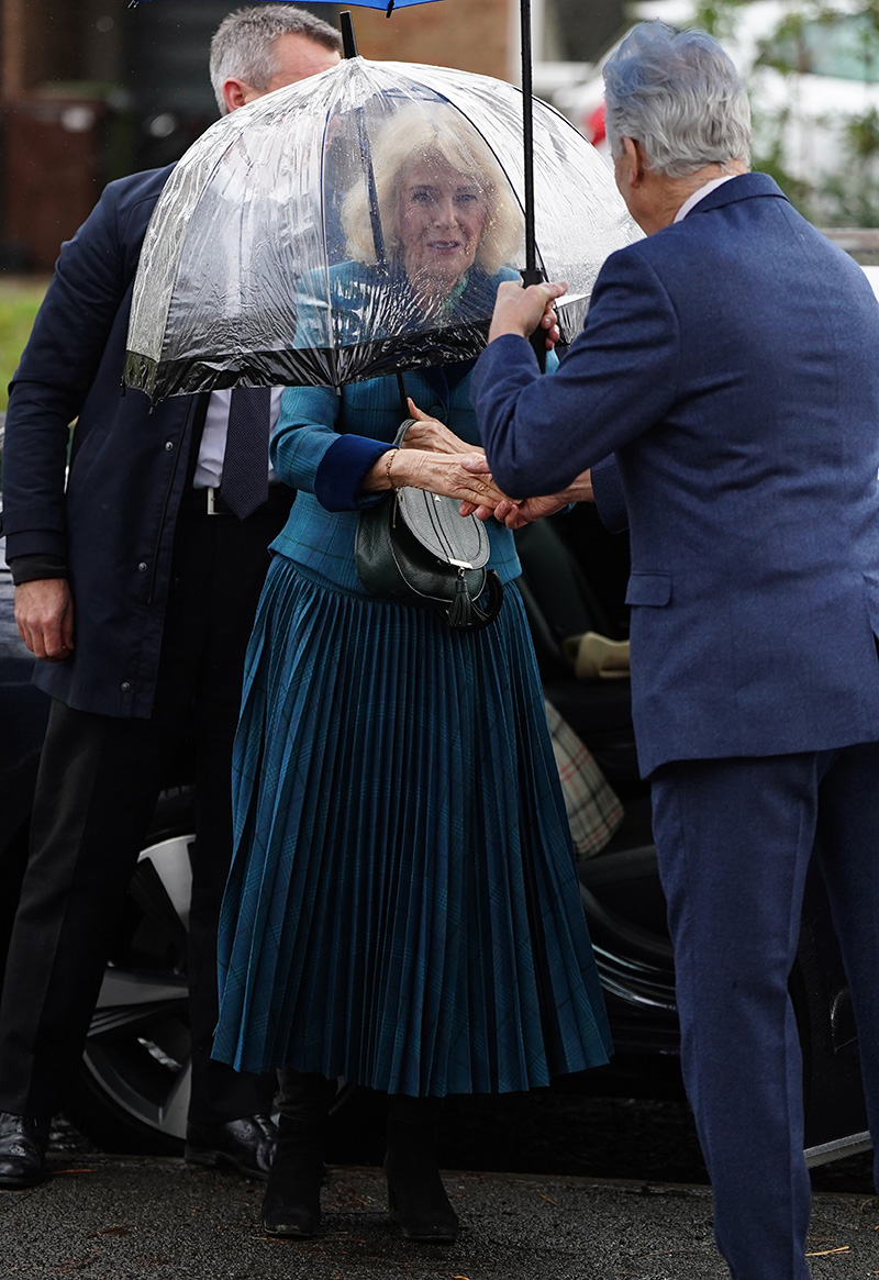 Queen Camilla wears Fiona Clare in Cheltenham, Gloucestershire, on Jan. 21, 2026 in Cheltenham, United Kingdom.