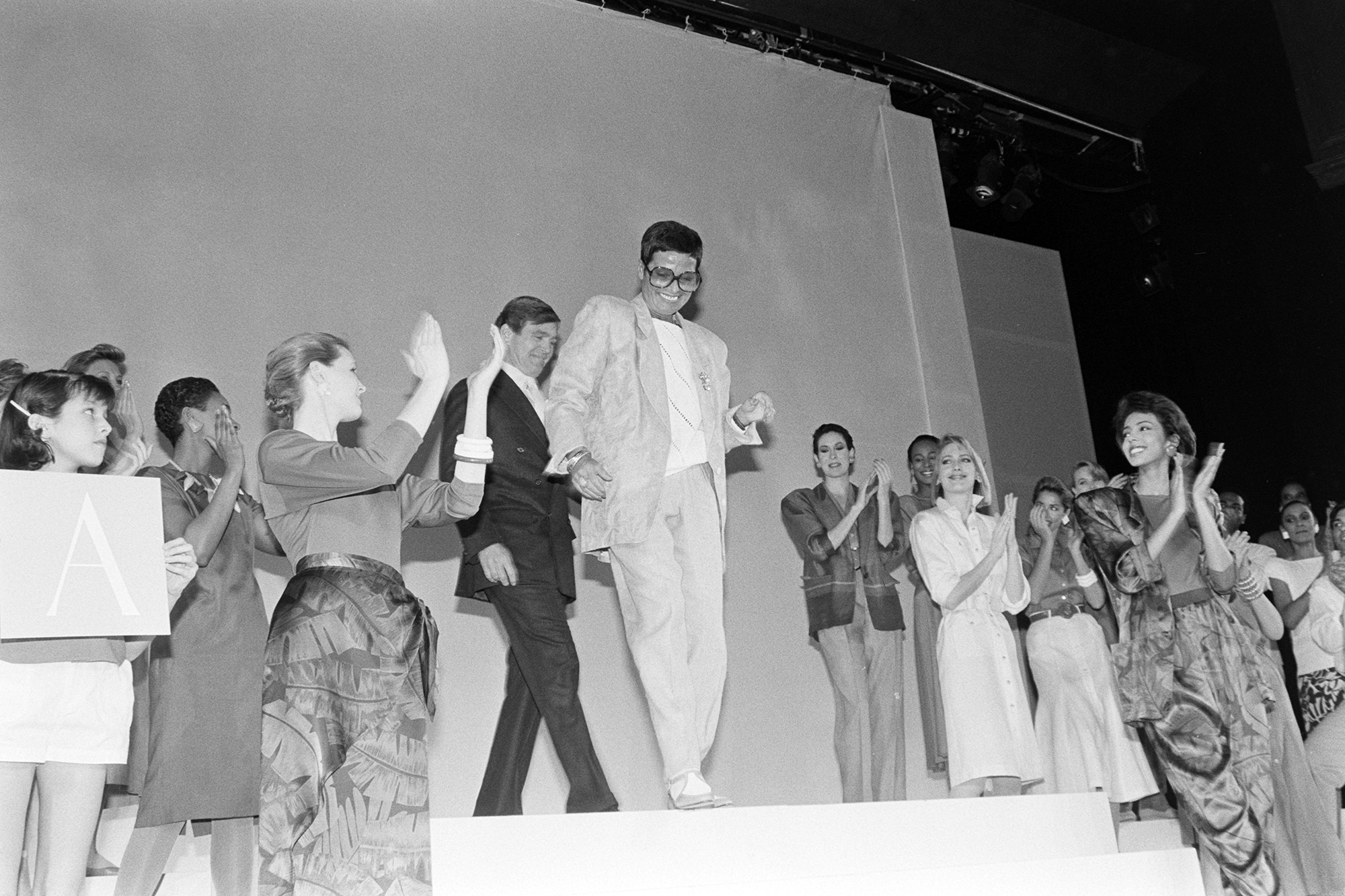 Liz Claiborne (C) and guests attend an event at the flagship Marshall Field's department store in Chicago, Illinois, on March 6, 1986.